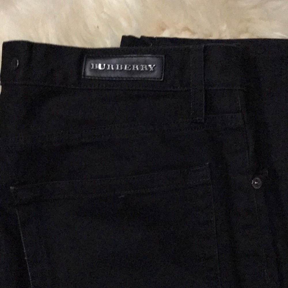 Burberry steadman button black jeans.  The waist feels more like 32-33 than 34.